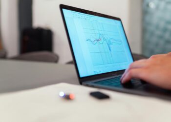 person using black laptop computer